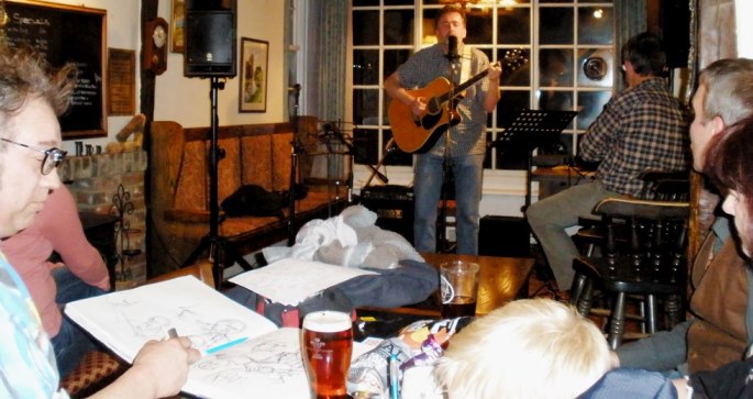 Danny McEvoy doing another drawing, whilst I play a couple of my tunes on 8.04.13 - Photo by: John Armstrong