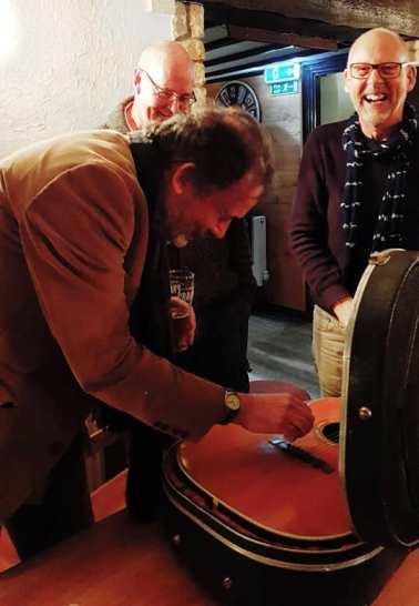 Inspecting an old Martin at the Cove Inn - 4/04/19 Photo: Heather