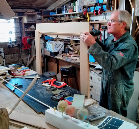 Richard Meed building the stage for use in the video for the song Social Media