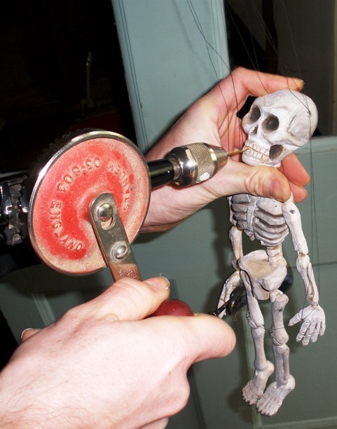 Is it safe? Tony Sinnett prepares the Skeleton to play the trumpet!